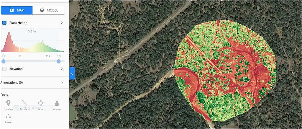 A satellite image showing winding roads through a dense forest area.