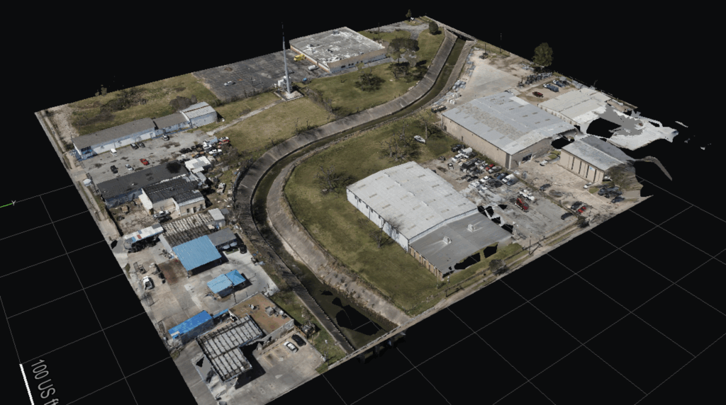 Aerial view of an industrial complex with buildings and a winding road.