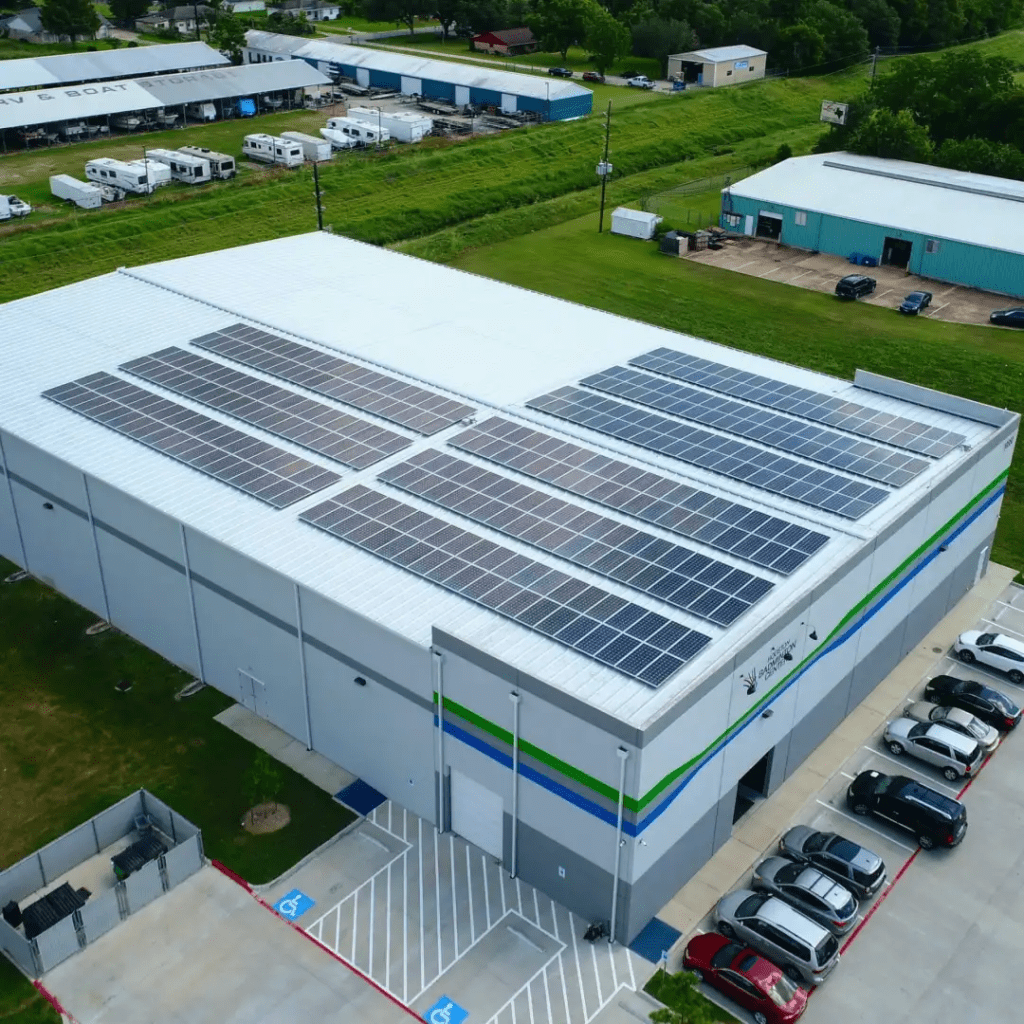 Building with solar panels on the roof.